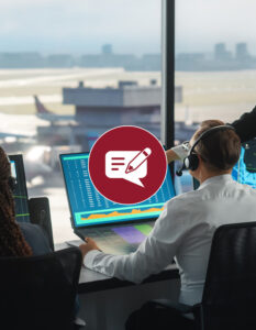 Three people wearing headsets infront of many computer screens with a window infront of them revealing an airport runway with planes.